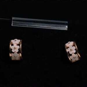 Chic Gold Earrings with White Floral Accents